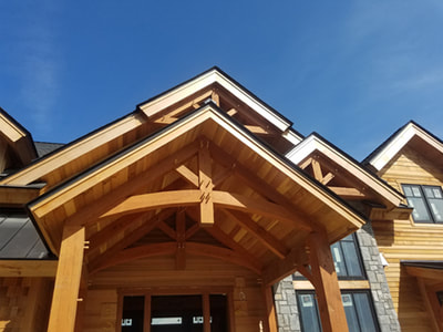 front porch timber braces on a post and beam home