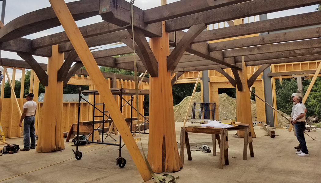 Raising the frame of a barn style guest house
