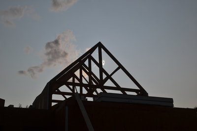 post and beam frame at sunset